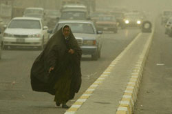 Baghdad woman and sandstorm