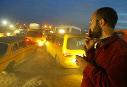 A Palestinian man breaks his Ramadan fast at a Gaza checkpoint