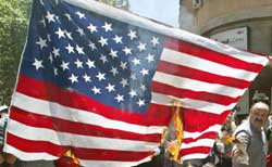 Anti-APEC Chilean demonstrators burn the US flag