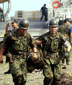Japanese soldiers carrying medicines and equipment