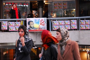 This picture, taken in Iran during last week's election, shows the stark contrast between the clothing diktats of conservative government figures and the daily attire of Iranian women who are getting more careless about the Islamic dress codes — a mood which was reflected in their votes against President Mahmoud Ahmadinejad's candidates. (Photo: Arash Ashoorinia, www.kosoof.com)
