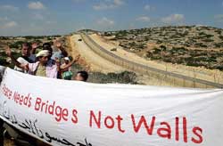 Members of the International Solidarity Movement hold a banner