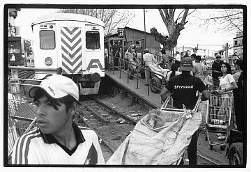 Cartoneros wait for a train to take them to downtown Buenos Aires, Argentina